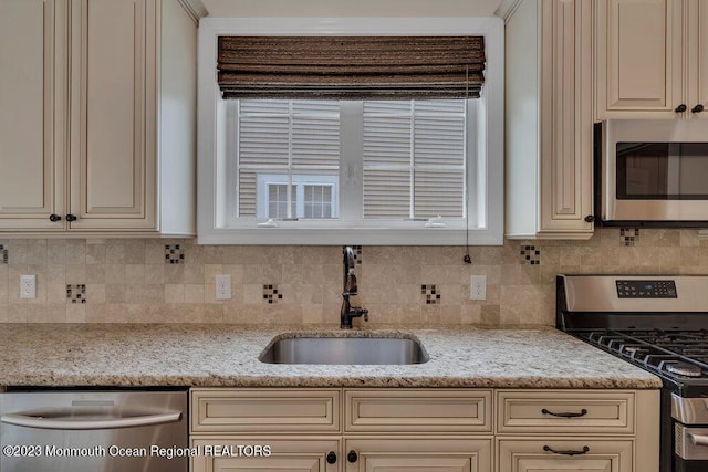 25 Merion Ln, Jackson, NJ 08527 - kitchen with cream cabinetry, stainless steel appliances, and tasteful backsplash