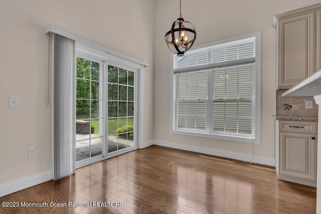 25 Merion Ln, Jackson, NJ 08527 - unfurnished dining area with a chandelier and wood finished floors