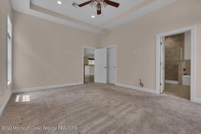 25 Merion Ln, Jackson, NJ 08527 - unfurnished bedroom with carpet floors, recessed lighting, connected bathroom, a tray ceiling, and ceiling fan