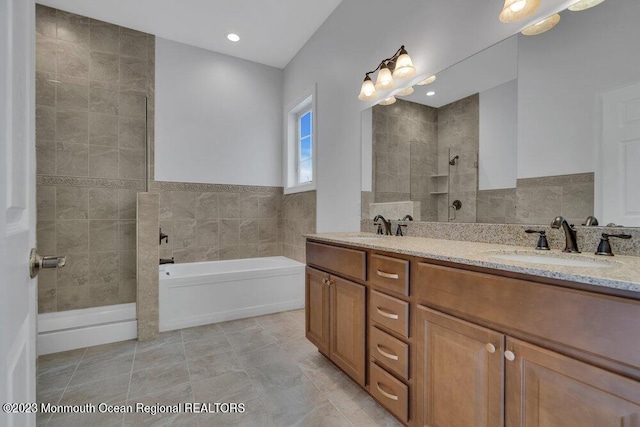 25 Merion Ln, Jackson, NJ 08527 - bathroom featuring a garden tub, double vanity, walk in shower, and tile walls
