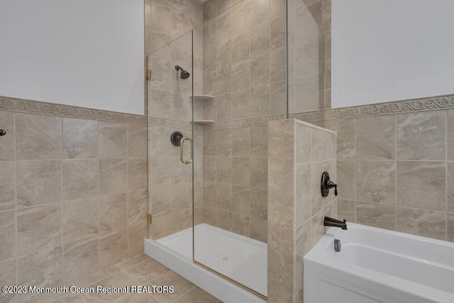 25 Merion Ln, Jackson, NJ 08527 - full bath featuring tiled shower, a bath, and tile walls
