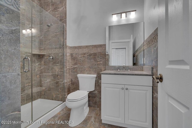 25 Merion Ln, Jackson, NJ 08527 - bathroom with vanity, a stall shower, and tile walls