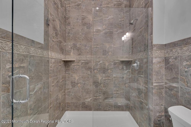 25 Merion Ln, Jackson, NJ 08527 - bathroom featuring a stall shower and tile walls