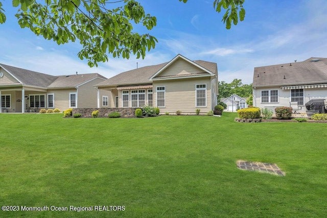 25 Merion Ln, Jackson, NJ 08527 - rear view of house featuring a yard