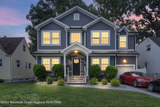 767 Hemlock Rd, Union, NJ 07083 - view of front facade with a front yard, a garage, and stone siding