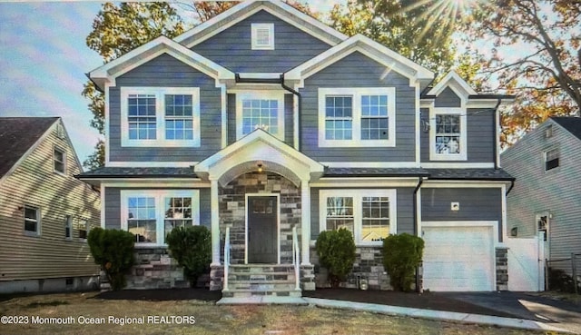 767 Hemlock Rd, Union, NJ 07083 - craftsman-style home featuring an attached garage, stone siding, and driveway