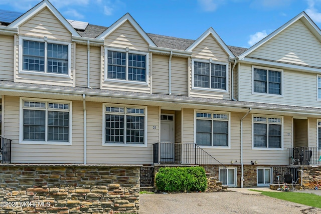 25 Rockefeller Dr, Lakewood, NJ 08701 - view of property with roof mounted solar panels