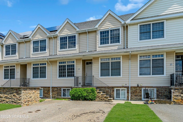 25 Rockefeller Dr, Lakewood, NJ 08701 - view of property with roof mounted solar panels