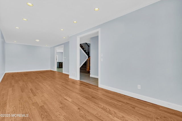 25 Rockefeller Dr, Lakewood, NJ 08701 - unfurnished room with recessed lighting, crown molding, stairs, and light wood finished floors