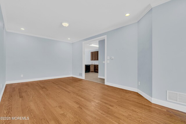 25 Rockefeller Dr, Lakewood, NJ 08701 - empty room with crown molding, light wood-style flooring, and recessed lighting