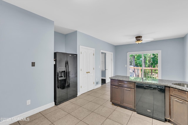 25 Rockefeller Dr, Lakewood, NJ 08701 - kitchen featuring black appliances, light tile patterned floors, a ceiling fan, and light stone counters