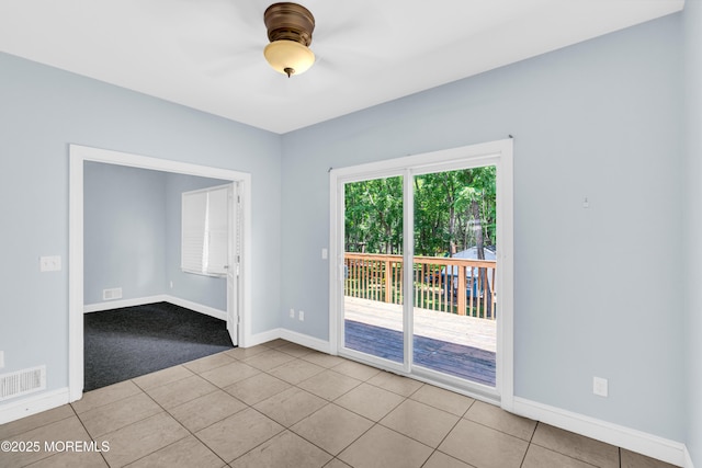25 Rockefeller Dr, Lakewood, NJ 08701 - tiled spare room featuring a ceiling fan and carpet floors