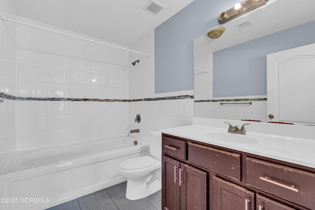 25 Rockefeller Dr, Lakewood, NJ 08701 - full bath featuring vanity, bathtub / shower combination, tile patterned floors, and tile walls