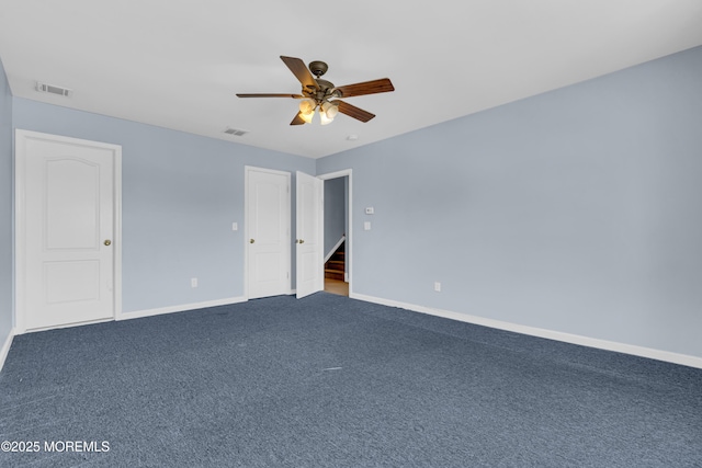 25 Rockefeller Dr, Lakewood, NJ 08701 - unfurnished bedroom featuring dark carpet and a ceiling fan
