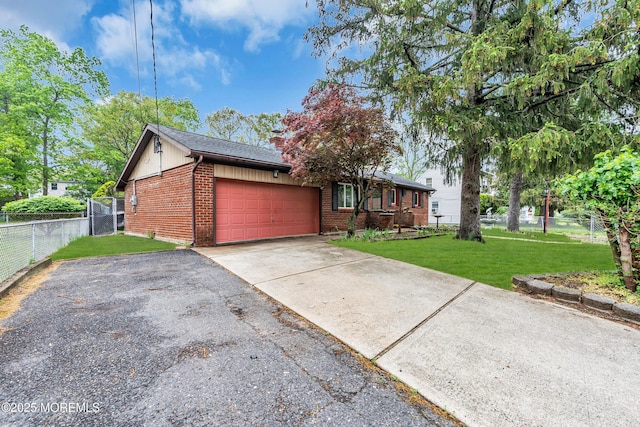 215 Sunset Ln, Howell, NJ 07731 - view of front of house featuring driveway, brick siding, a garage, and a chimney