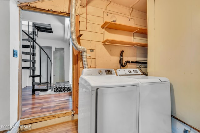 215 Sunset Ln, Howell, NJ 07731 - laundry room with independent washer and dryer and wood finished floors