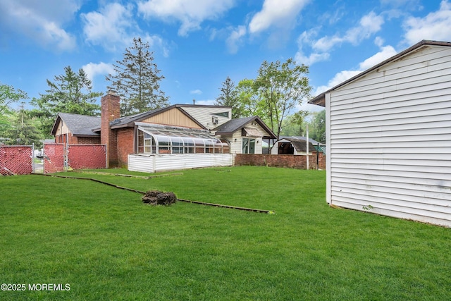 215 Sunset Ln, Howell, NJ 07731 - back of house with a chimney and a sunroom