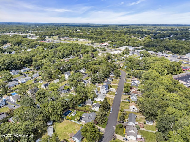 215 Sunset Ln, Howell, NJ 07731 - aerial overview of property's location with nearby suburban area and a forest