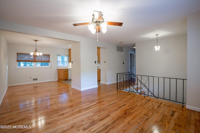 2152 Dover Pines Ave, Toms River, NJ 08755 - spare room with light wood-style floors, a chandelier, and ceiling fan