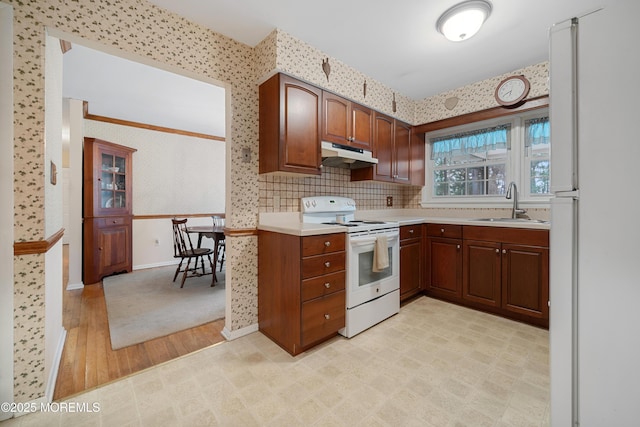 446 Steuben Ave, Forked River, NJ 08731 - kitchen featuring white appliances, under cabinet range hood, wallpapered walls, light countertops, and light wood-style floors