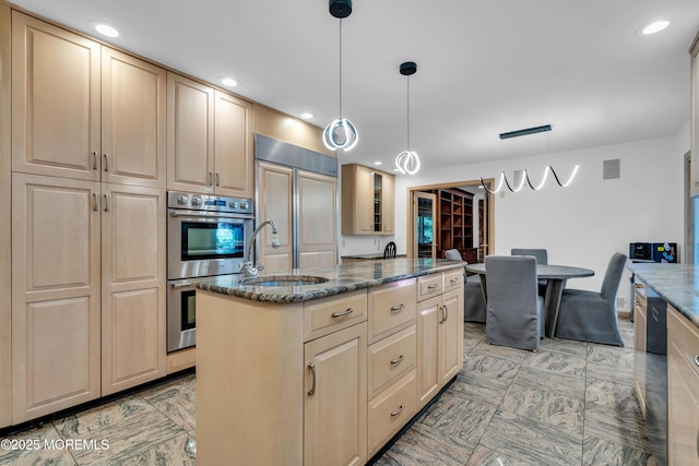 27 Darby Rd, East Brunswick, NJ 08816 - kitchen featuring double oven, paneled fridge, dark stone countertops, a kitchen island, and recessed lighting