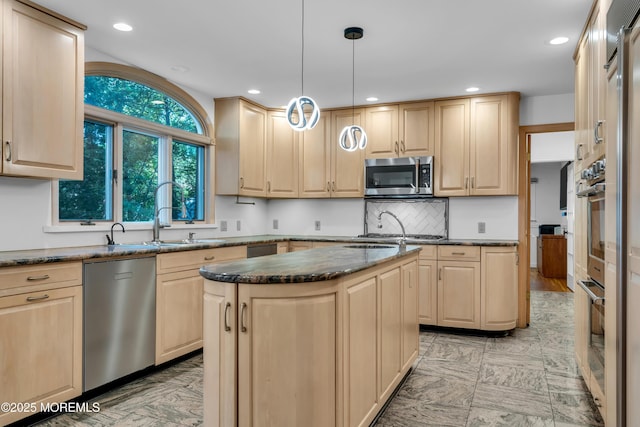 27 Darby Rd, East Brunswick, NJ 08816 - kitchen with stainless steel appliances, light brown cabinets, dark stone countertops, a center island, and recessed lighting