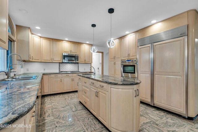 27 Darby Rd, East Brunswick, NJ 08816 - kitchen featuring stainless steel appliances, recessed lighting, dark stone countertops, backsplash, and a kitchen island with sink