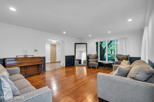 27 Darby Rd, East Brunswick, NJ 08816 - living room featuring arched walkways, crown molding, wood finished floors, and recessed lighting