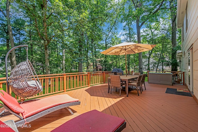 27 Darby Rd, East Brunswick, NJ 08816 - deck with outdoor dining space and view of scattered trees