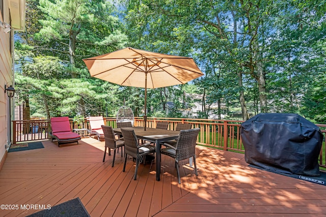 27 Darby Rd, East Brunswick, NJ 08816 - deck with area for grilling, outdoor dining area, and view of scattered trees