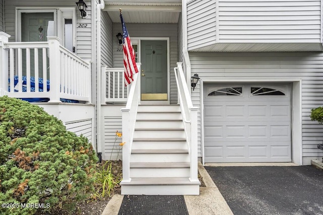 203 Muskflower Ct, Toms River, NJ 08753 - property entrance featuring a garage and driveway