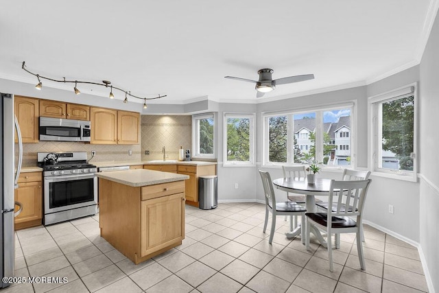203 Muskflower Ct, Toms River, NJ 08753 - kitchen featuring stainless steel appliances, light countertops, light tile patterned floors, tasteful backsplash, and ornamental molding