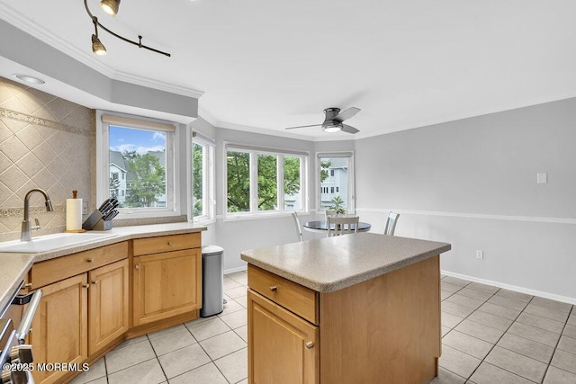 203 Muskflower Ct, Toms River, NJ 08753 - kitchen with light tile patterned flooring, crown molding, a ceiling fan, a kitchen island, and tasteful backsplash