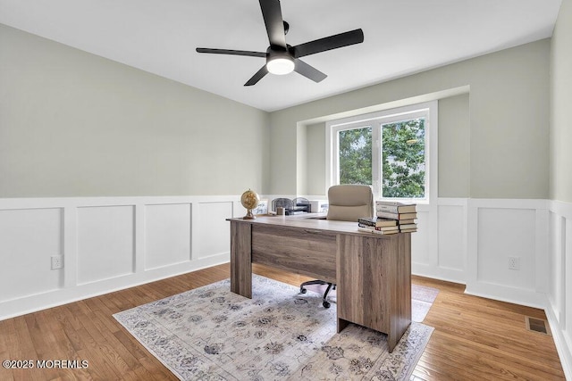 203 Muskflower Ct, Toms River, NJ 08753 - home office with ceiling fan, a decorative wall, a wainscoted wall, and light wood-style floors