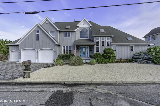 1030 Montauk Dr, Forked River, NJ 08731 - view of front of home featuring driveway, a shingled roof, and a garage