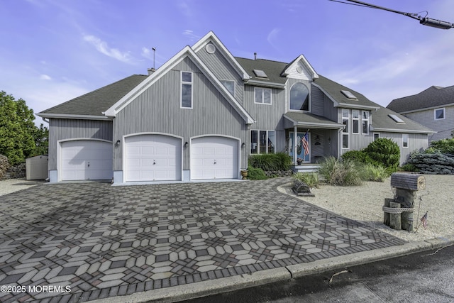 1030 Montauk Dr, Forked River, NJ 08731 - view of front of home featuring decorative driveway and roof with shingles