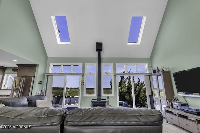 1030 Montauk Dr, Forked River, NJ 08731 - living room featuring a skylight, high vaulted ceiling, and a wood stove