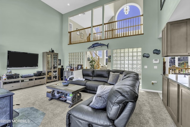 1030 Montauk Dr, Forked River, NJ 08731 - living room featuring a towering ceiling, carpet floors, and stairway