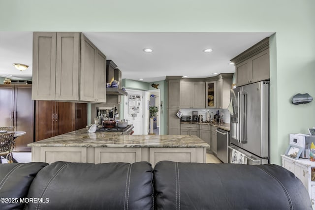 1030 Montauk Dr, Forked River, NJ 08731 - kitchen with stainless steel appliances, a peninsula, glass insert cabinets, light stone counters, and recessed lighting