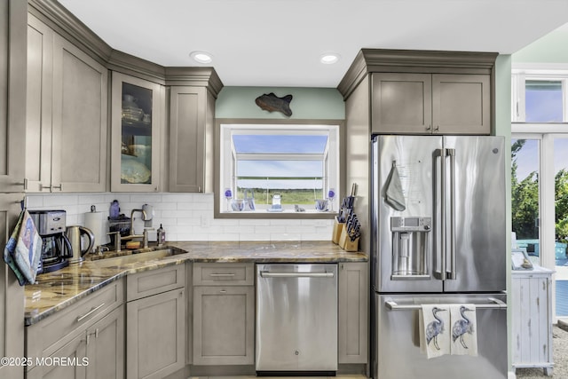 1030 Montauk Dr, Forked River, NJ 08731 - kitchen with stainless steel appliances, stone counters, backsplash, glass insert cabinets, and recessed lighting