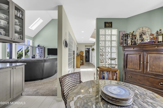 1030 Montauk Dr, Forked River, NJ 08731 - dining space with vaulted ceiling, a skylight, and recessed lighting
