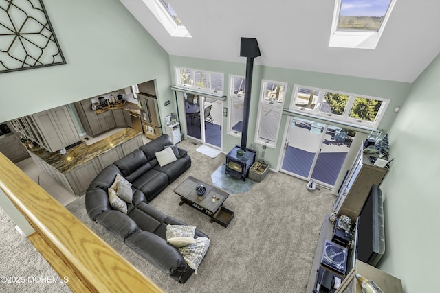 1030 Montauk Dr, Forked River, NJ 08731 - carpeted living area with a skylight, high vaulted ceiling, and plenty of natural light
