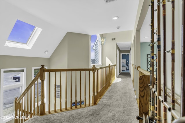 1030 Montauk Dr, Forked River, NJ 08731 - hall featuring carpet floors, a skylight, an upstairs landing, lofted ceiling, and recessed lighting