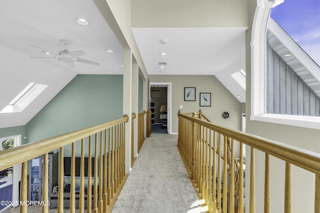1030 Montauk Dr, Forked River, NJ 08731 - hall featuring lofted ceiling, carpet floors, recessed lighting, a skylight, and an upstairs landing