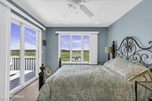 1030 Montauk Dr, Forked River, NJ 08731 - carpeted bedroom with access to exterior, multiple windows, and ceiling fan