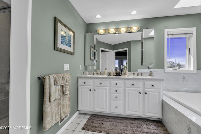 1030 Montauk Dr, Forked River, NJ 08731 - full bathroom featuring double vanity, tile patterned floors, healthy amount of natural light, and a garden tub
