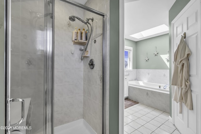 1030 Montauk Dr, Forked River, NJ 08731 - full bathroom featuring a skylight, tile patterned floors, a bath, and a shower stall