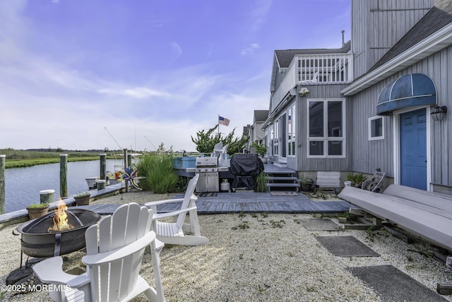 1030 Montauk Dr, Forked River, NJ 08731 - view of yard with a fire pit, a deck with water view, and a balcony