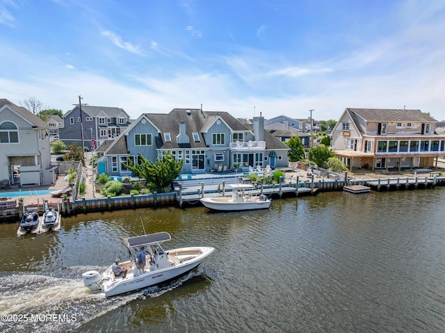 1030 Montauk Dr, Forked River, NJ 08731 - dock with a residential view, a water view, a fenced backyard, and a patio