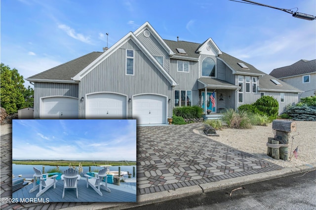 1030 Montauk Dr, Forked River, NJ 08731 - view of front of home with roof with shingles, driveway, and a water view
